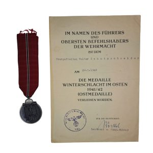Ostmedal with awarding document