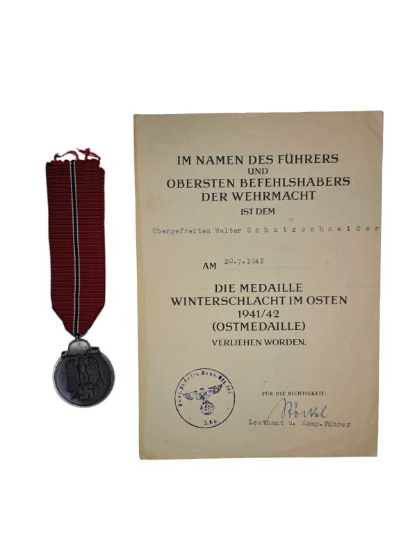 Ostmedal with awarding document
